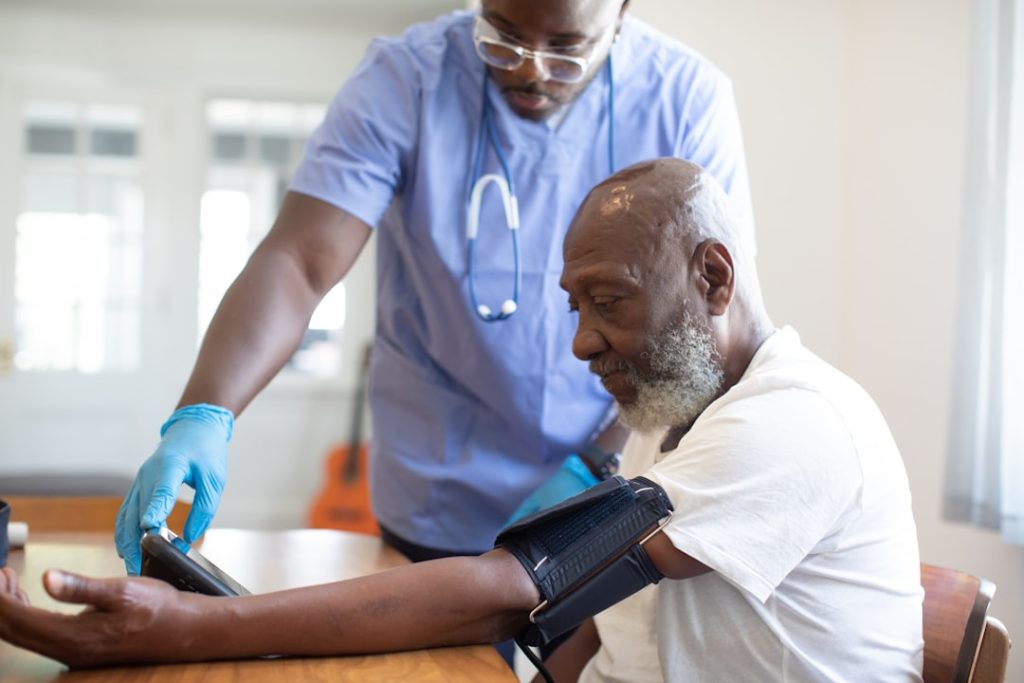 high blood pressure clinical reading older adult with cuff on arm